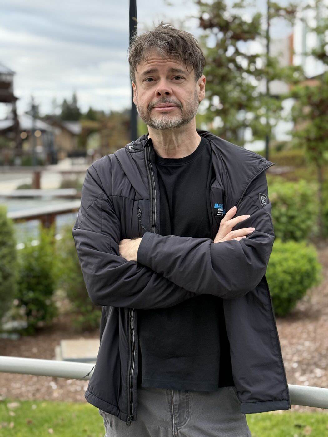 Steve outdoors, arms crossed
