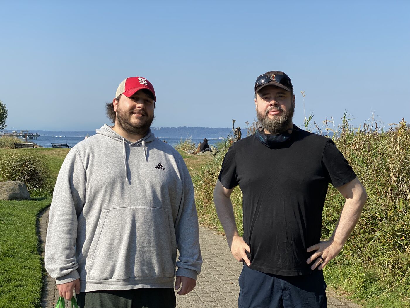 Steve with a friend, outdoors by the water