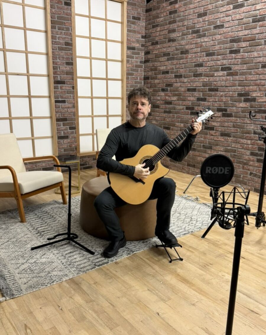 Steve Yegge playing classical guitar at the studio