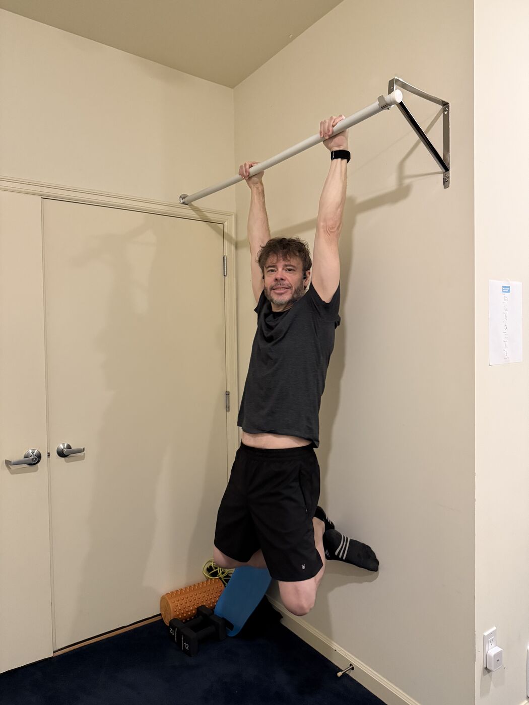 Steve hanging from a pull-up bar