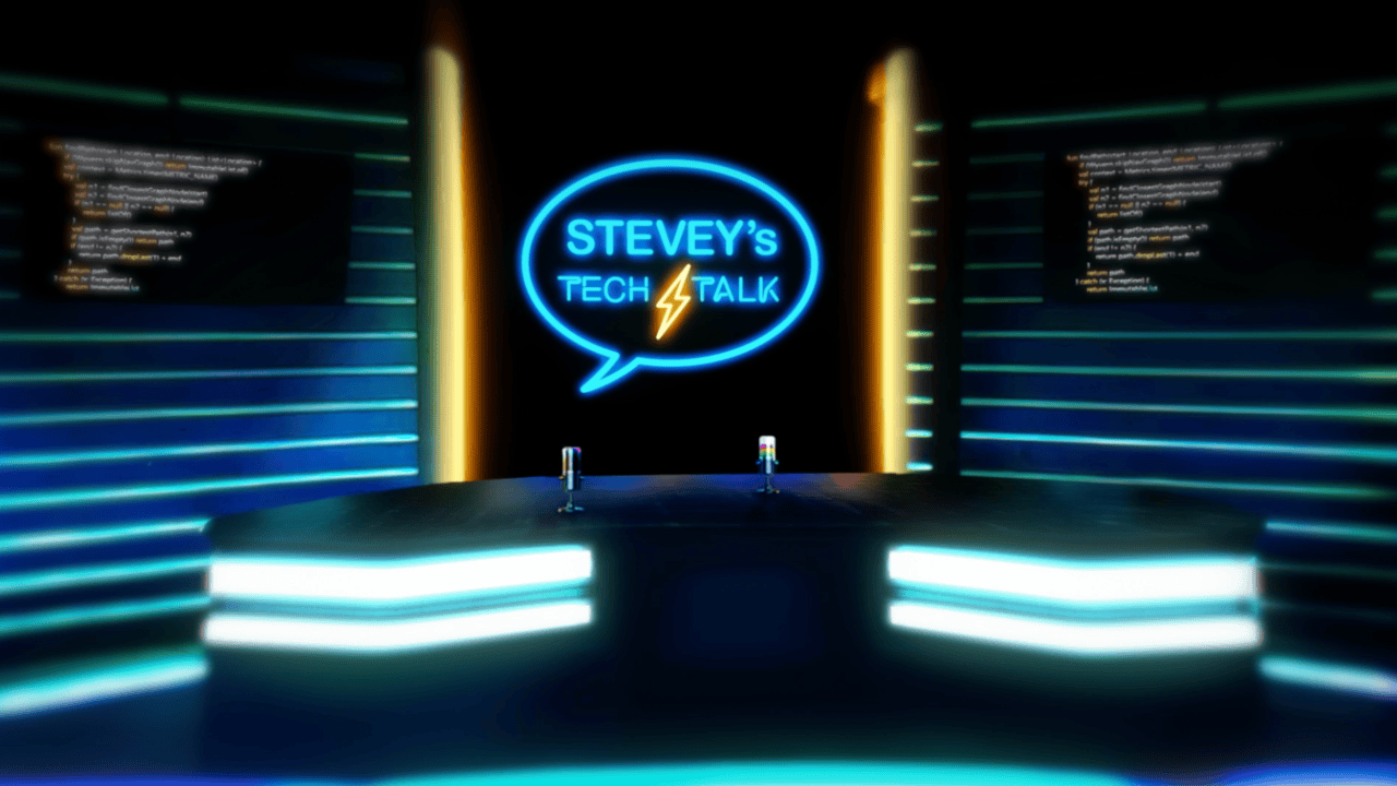 Stevey's Tech Talk title card — a neon-lit news-desk stage with lines of code glowing on the screens behind it, and the show's speech-bubble logo above the desk.