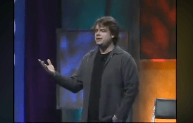 Steve Yegge mid-gesture on the OSCON 2007 keynote stage